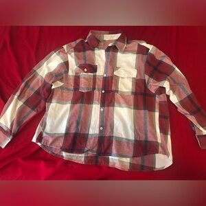 Red checkered flannel. Size M. Worn quite a bit. Missing on button near the top.